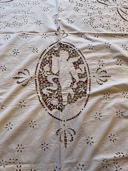 null A white cotton bedspread, embroidery of openwork bows, in the center a cherub...