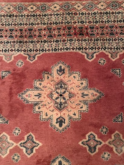 null Wool carpet, old pink background, in the center three rhombuses.
Kakachi, Pakistan...