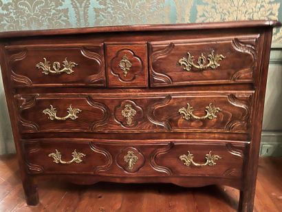 null A molded wood chest of drawers, opening with five drawers on three rows. Ile...