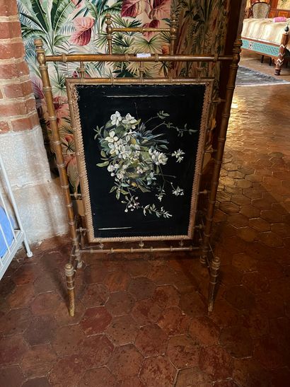 null Gilded wood and black silk mantelpiece with a painted bouquet of white flowers....