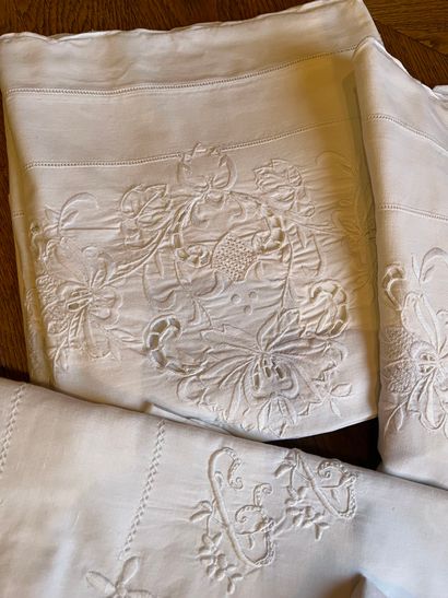 null A white cotton bedspread, embroidery of openwork bows, in the center a cherub...
