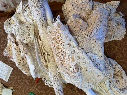 Set of three round crochet tablecloths, a...