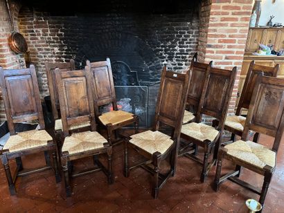 null Suite of twelve chairs with high back, stained wood and straw seat. 
Rustic...
