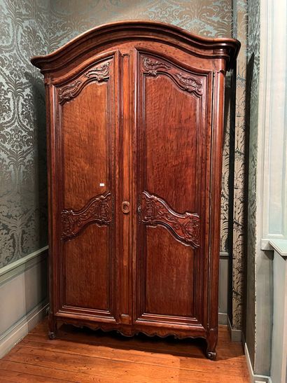 null Mahogany cabinet called "de port" molded and carved with rocaille 
and foliated...