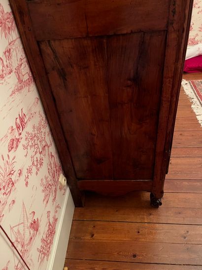 null Large carved and molded wood cabinet, decorated with a basket of flowers, scrolled...