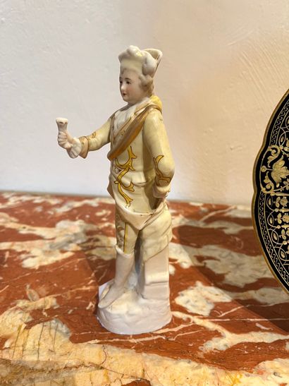 null Lot including: a cookie statuette representing a man in court dress and a porcelain...