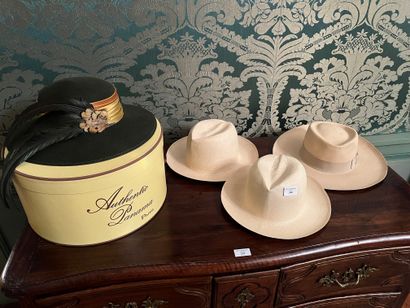 null Lot of four hats including three type "Panama" (one marked) and a black felt...