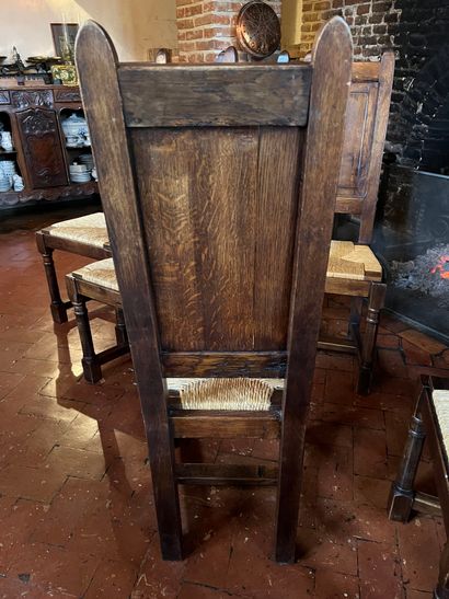 null Suite of twelve chairs with high back, stained wood and straw seat. 
Rustic...