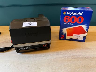 A Polaroid Lightmixer 630 camera and a box...
