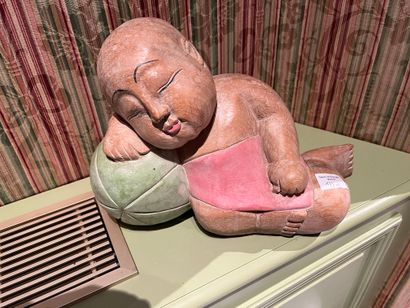 null Two children in polychrome wood sleeping on watermelons. 
Work in the Asian...