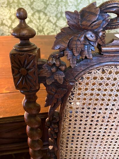 null Suite of three caned chairs in stained wood, high back, uprights carved with...
