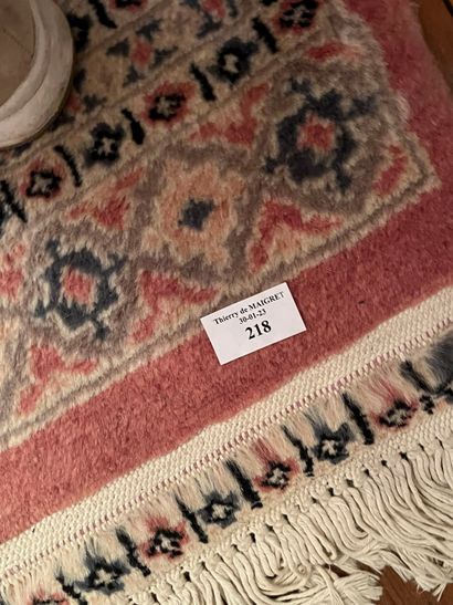 null Wool carpet, old pink background, in the center three rhombuses.
Kakachi, Pakistan...