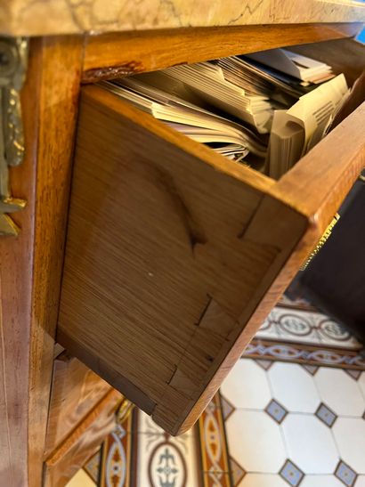 null Veneer chest of drawers, framed with clear fillets. Opens with three drawers....