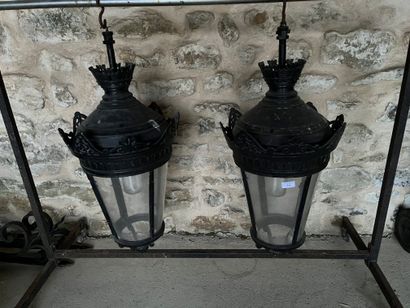 Pair of lanterns and their gallows in black...