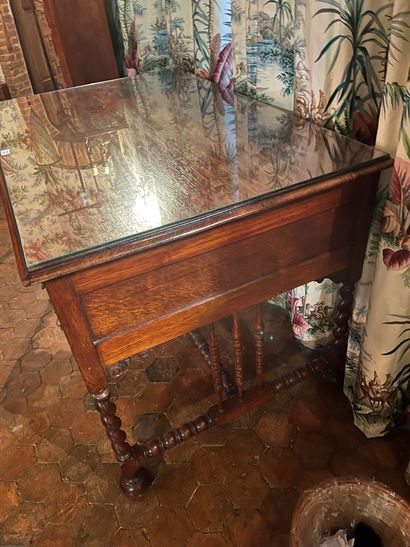 null Boxed desk in tinted wood with turned wood struts. It opens with four drawers....