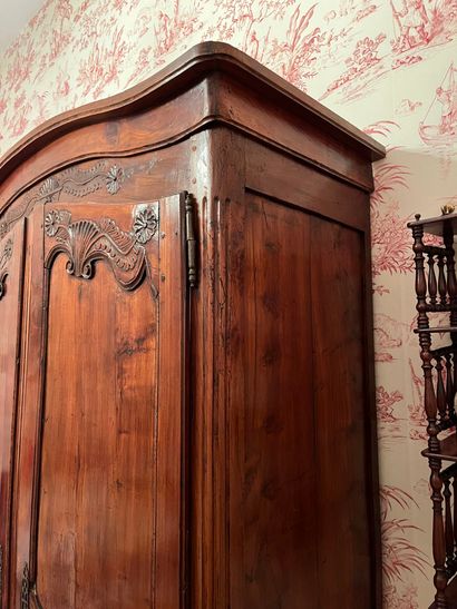 null Large carved and molded wood cabinet, decorated with a basket of flowers, scrolled...