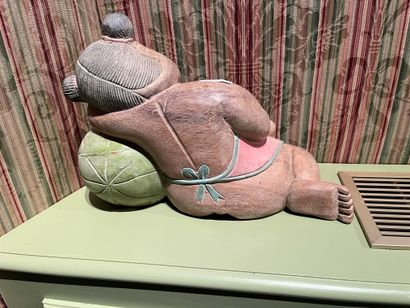 null Two children in polychrome wood sleeping on watermelons. 
Work in the Asian...