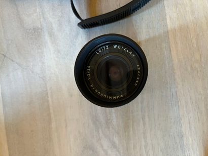 null Leica R4 camera and Summicron R lens Leitz Wetzlar 
Lot sold as is without warranty,...