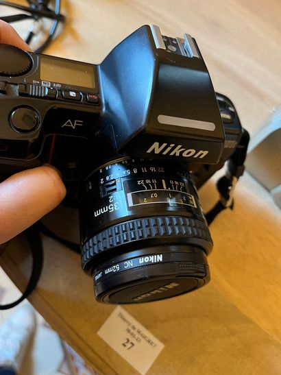 null Lot including a Nikon F-801S camera, another Nikon D90 with two Nikon lenses,...