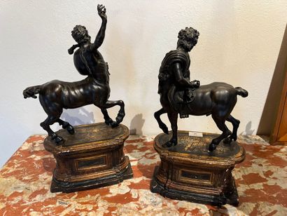 null Pair of centaurs said of FURIETI, bronze with dark patina, on oblong patinated...