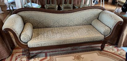 null Sofa with curved back in stained wood and carved with gadroons, armrests with...