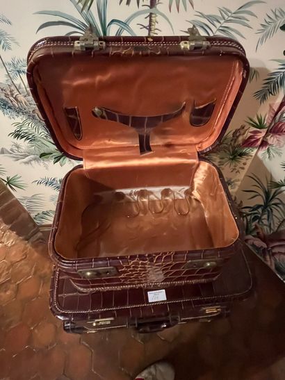 null Set of four leather luggage, crocodile style, monogrammed.
PADGITT'S DALLAS...