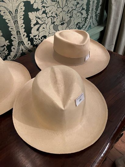 null Lot of four hats including three type "Panama" (one marked) and a black felt...