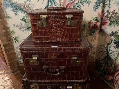 null Set of four leather luggage, crocodile style, monogrammed.
PADGITT'S DALLAS...