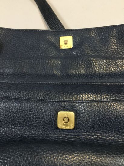 null FENDI: Navy blue grained leather messenger bag, shoulder strap, magnetic flap...