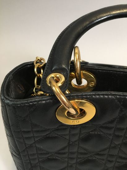 null Christian DIOR
Lady Dior" bag 24 cm in black cane leather, double handle, zipper...
