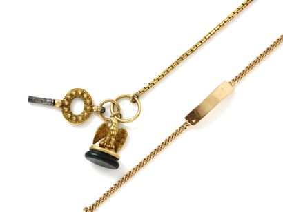 null Lot in 750 thousandths gold consisting of a fancy link keychain holding a watch...