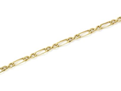 null Stylized gourmette link bracelet in 750 thousandths gold. Features a ratchet...