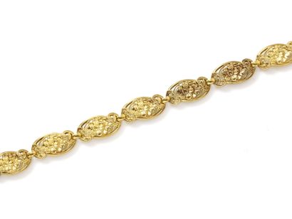 null Bracelet in 750 thousandths gold, with openwork links decorated with floral...