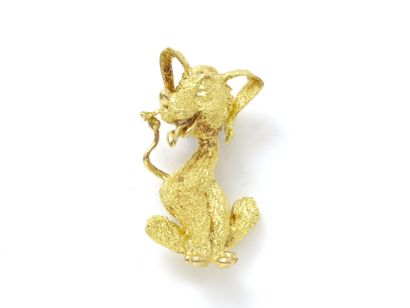 null Textured 750 thousandths gold brooch featuring a dog humorously depicted sitting...