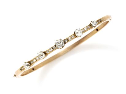 null 750 thousandths gold openwork bangle set with a drop of claw-set old-cut diamonds...