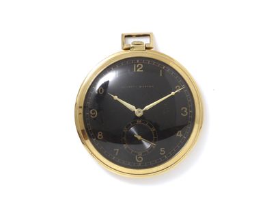 null TAVANNES WATCH & Co. 750 thousandths gold pocket watch. Signed mechanical movement....