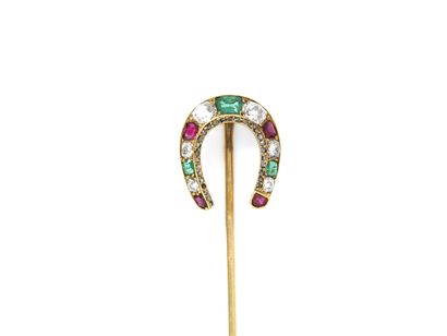 null 750 thousandths gold horseshoe tie pin set with emeralds, colored rubies, old-cut...