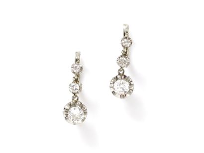 null Pair of 750 white gold and 850 thousandth platinum sleeper earrings, set with...