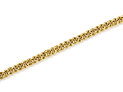 Bracelet in 750 thousandths gold, chased...