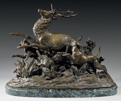 MONNEHAYE Groupe en bronze ciselé et patiné figurant la prise d'un cerf par les chiens....