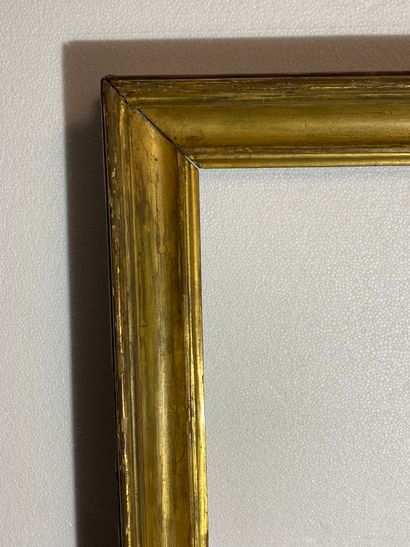 null A molded and gilded wooden hollow profile frame,
Italy, early 19th century
65...