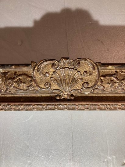 null A carved and gilded oak frame with beautiful Bérain-style decoration, Louis...