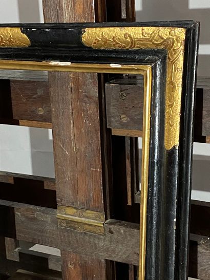 null Moulded, gilded and blackened limewood frame, Provence, Louis XIV period
25.5...