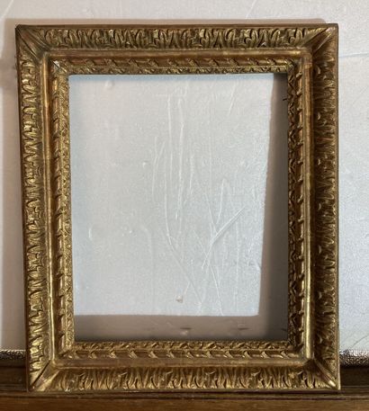 null A carved and gilded wooden frame decorated with acanthus leaf and ribbon friezes,...