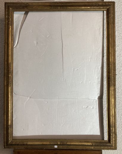null A molded and gilded wood frame with an inverted profile, decorated with reparure...