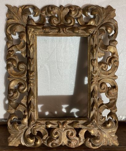 null A carved and gilded wood frame with openwork scrolls and acanthus decoration
Italy,...