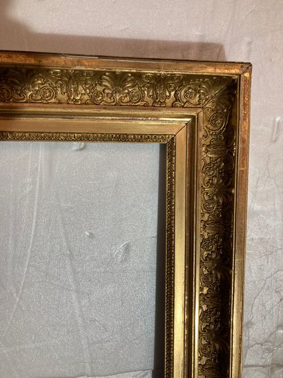 null A gilded wood and paste "à double gorges" frame decorated with palmettes
Empire...