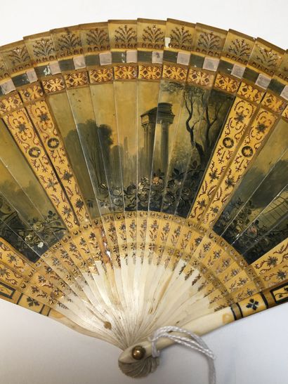 null Broken fan, in partially reperced bone, painted with gouache and varnish. The...