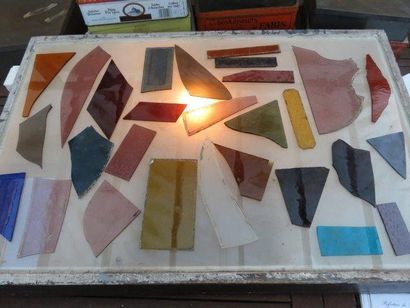 null Box containing approximately 54 mostly modern polychrome glass scraps. Box size...