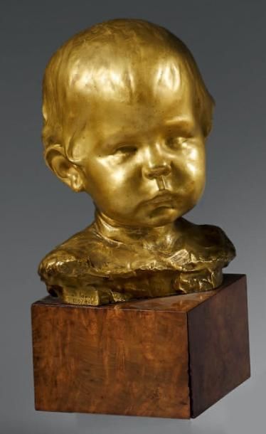 SCHNEGG Lucien (1864 - 1909) «Tête de bébé». Épreuve en bronze à patine dorée, fonte...